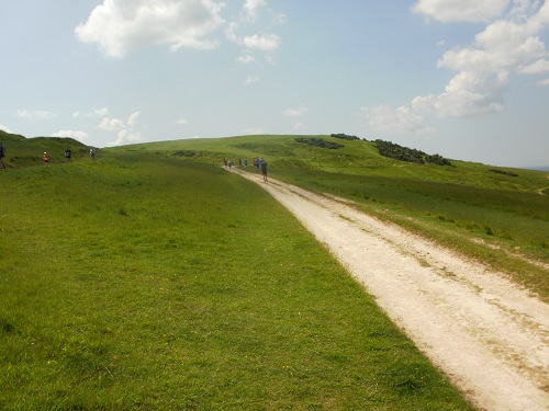 Some of the marathon runners approaching Cleeve Hill