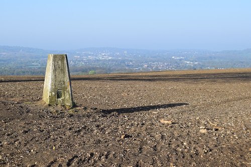 A trig point in a field on the North Downs Way