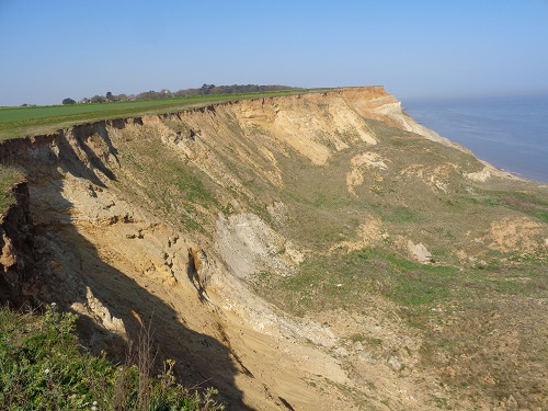Looking back at the crumbling cliffs near Trimingham