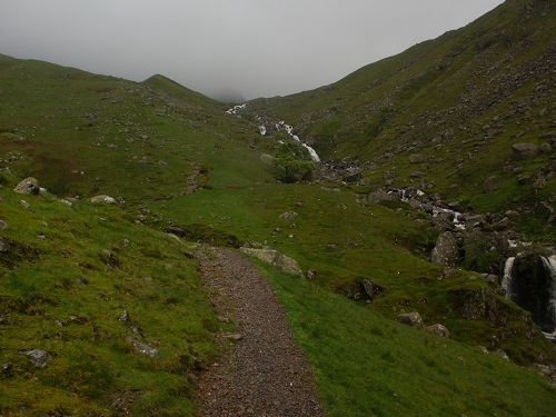 Walking beside Greenup Gill towards a cloud covered Greenup Edge