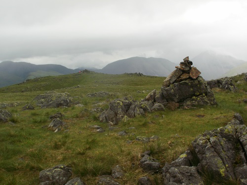 The summit cairn and view from Illgill Head
