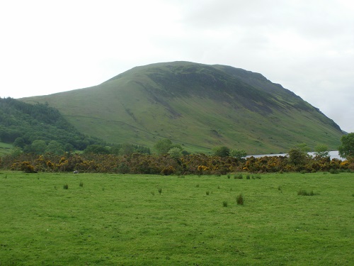 Looking up at the grassy slopes of Illgill Head