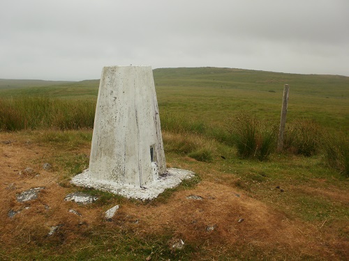 The summit cairn on Ochiltree Hill in the rain
