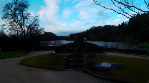 The Tom Weir statue in front of Loch Lomond